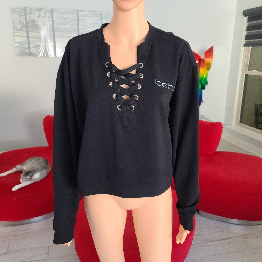 NWT BEBE sweatshirt with lacing black top size L